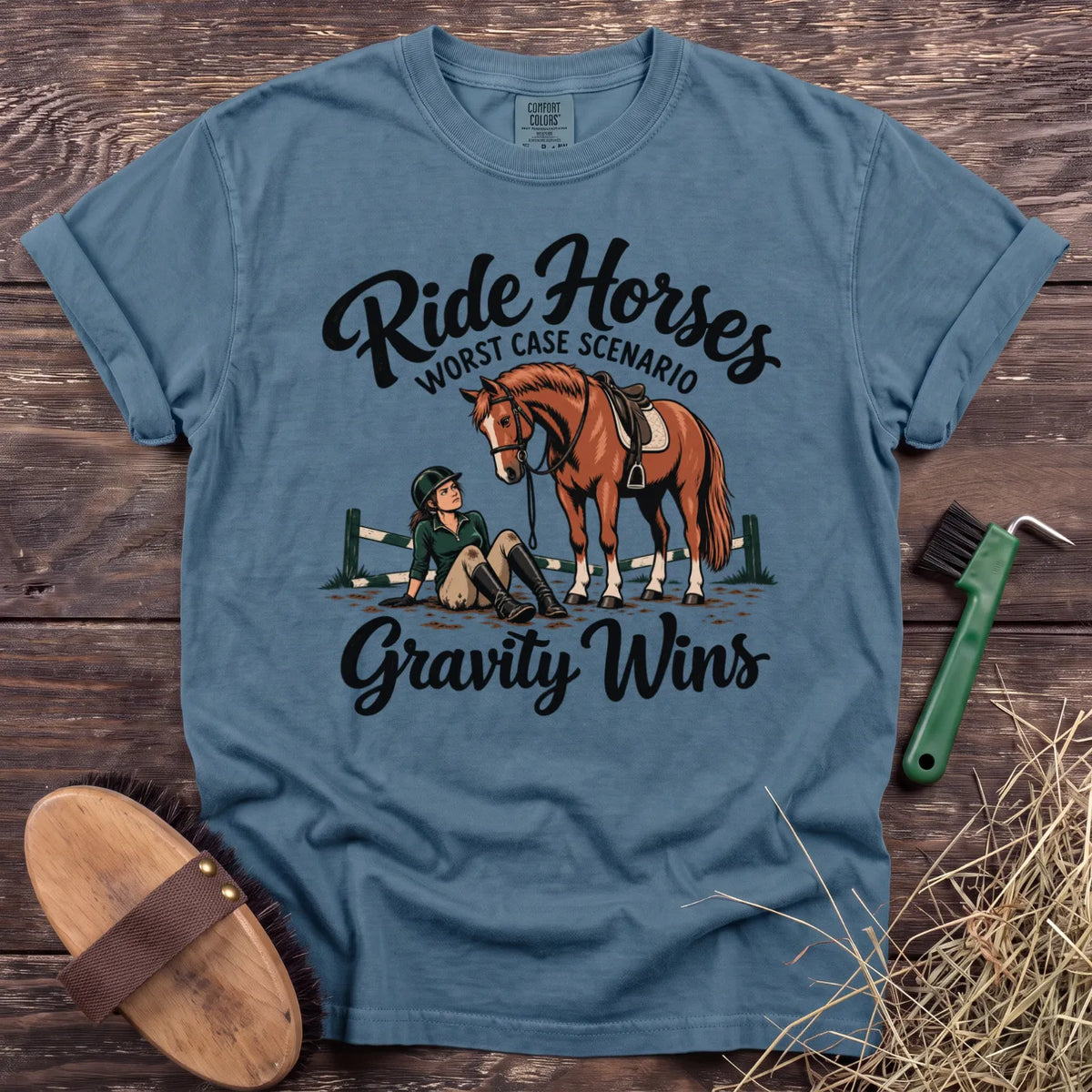 Ride Horses, Worst Case Scenario Gravity Wins T-shirt in Ice Blue with horse and seated rider [color: Ice Blue]