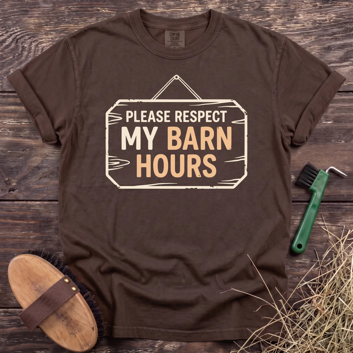 Respect My Barn Hours T-Shirt in Espresso, front view on a wooden barn surface. [color: Espresso]