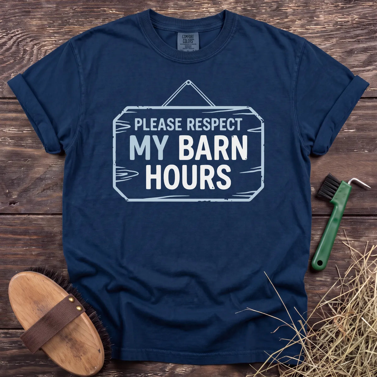Respect My Barn Hours T-Shirt in Navy, front view on a wooden barn surface. [color: Navy]