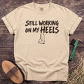 Working on My Heels T-Shirt in Ivory [color: Ivory]