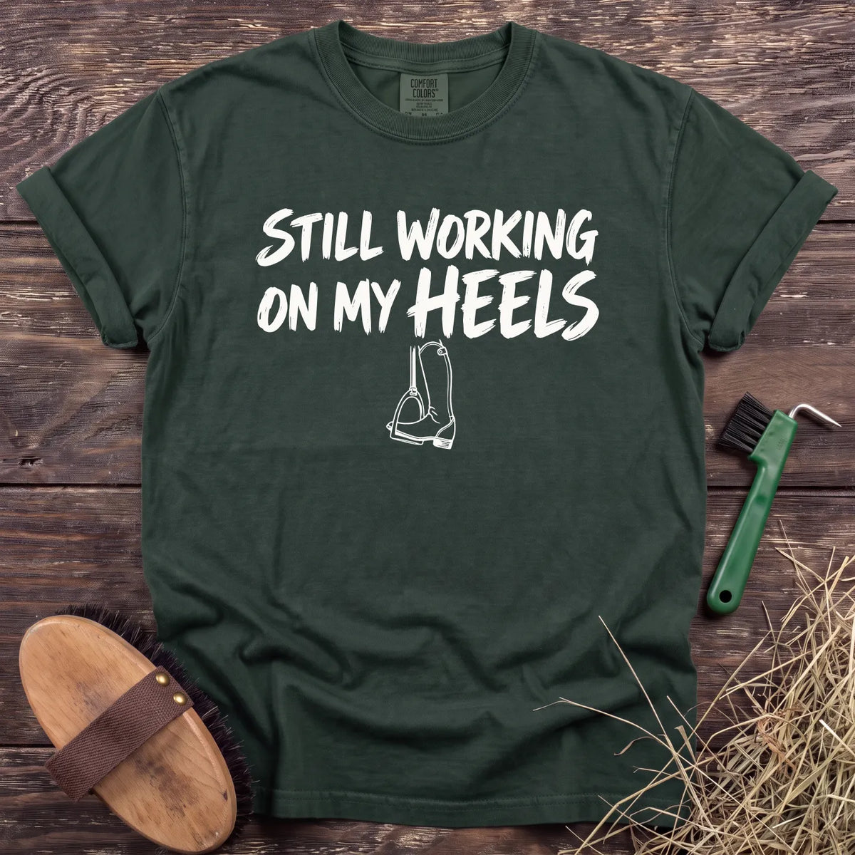 Working on My Heels T-Shirt in Moss [color: Moss]